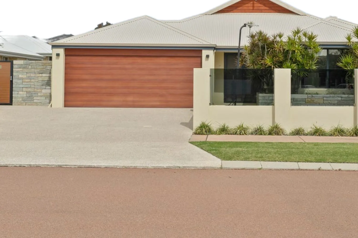 Concrete driveway and crossover in front of a new home