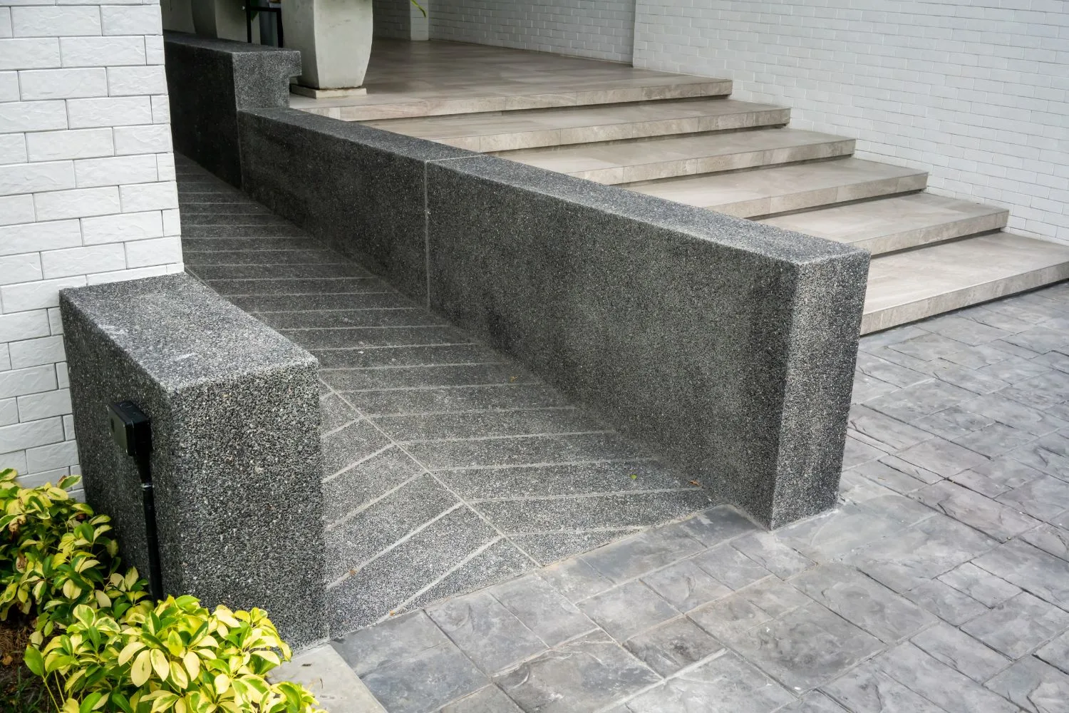 Concrete steps with a textured exposed aggregate landing