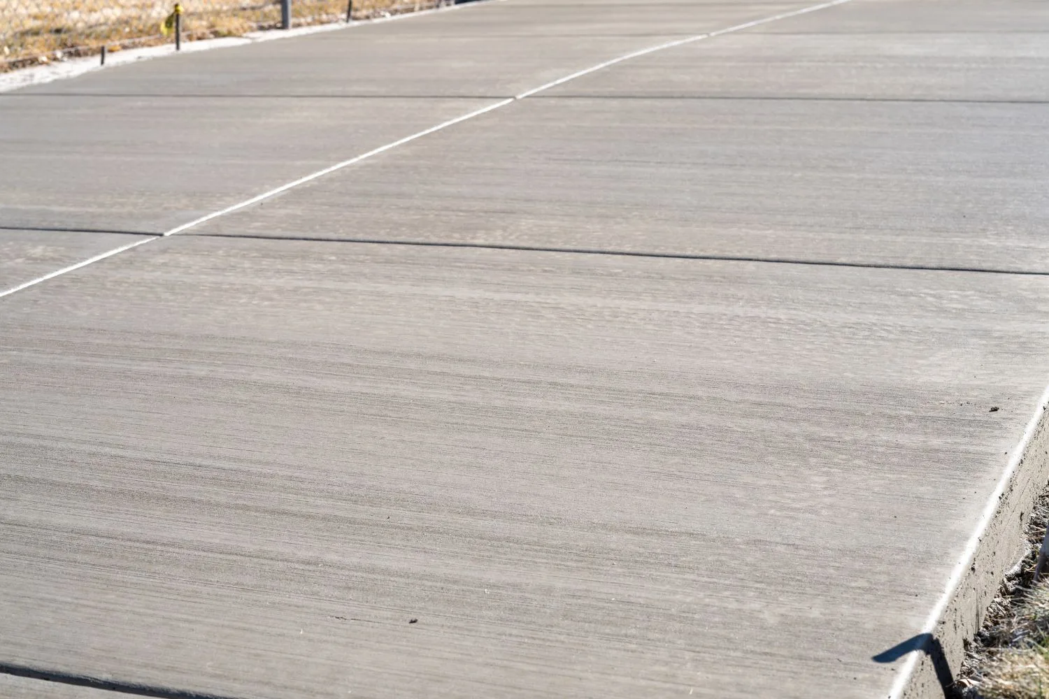 Broom-finished concrete slab with saw-cut control joints