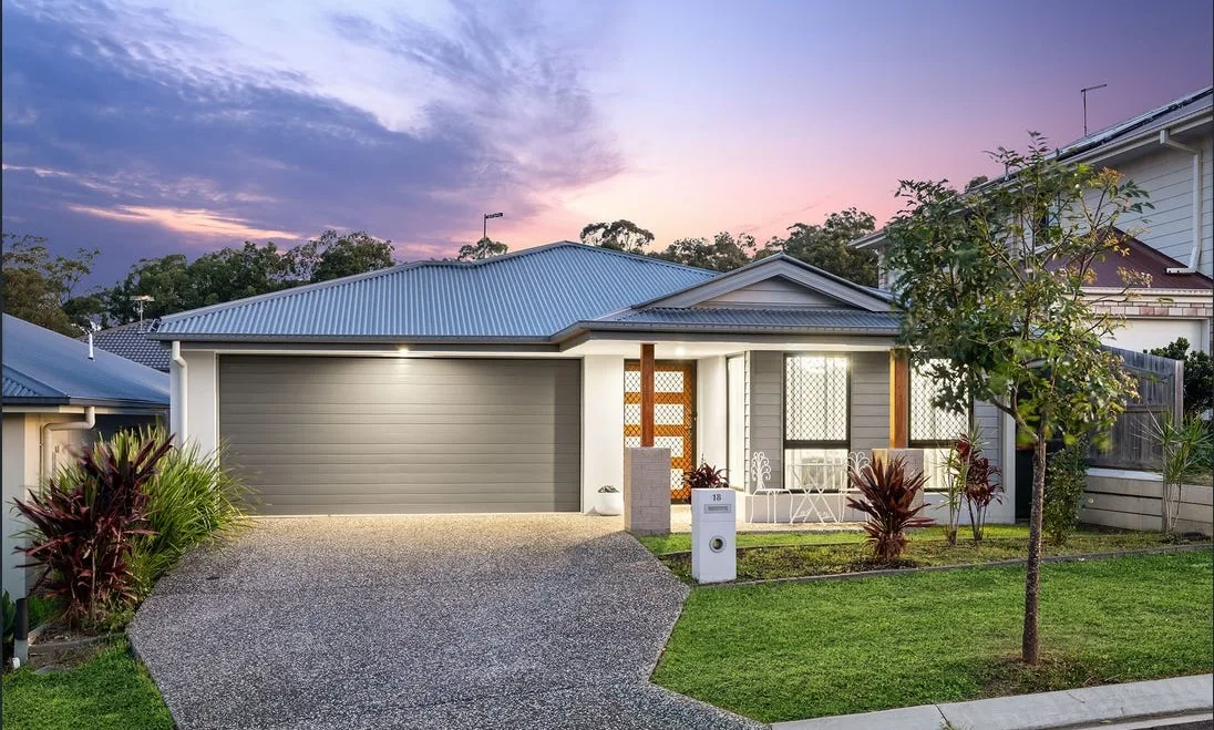 Exposed aggregate driveway at a new home at dusk